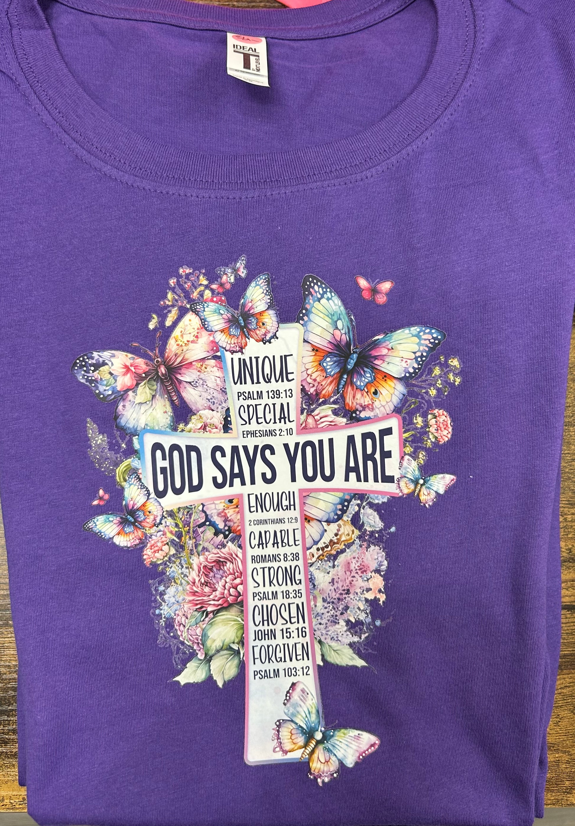 Purple T-shirt “God Says You Are…”